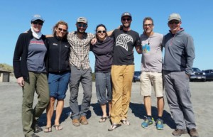 Instructor training program group standing arm in arm at Fort Stevens State Park.