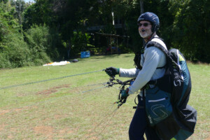 Paraglider pilot, ready to launch at Dominical.
