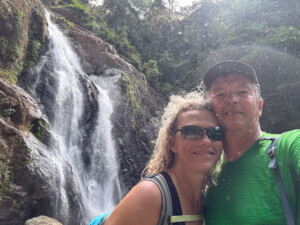 Brad and Maren standing in the mist below the highest falls in Costa Rica. Bijagual Falls.