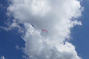 A paragliding in climbing out in the sky above Jaco!
