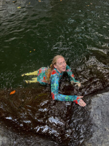Swimming in one of the larger and deeper pools on this river. Hanging on, just below the falls.