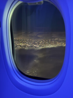 LA in the fog. On the last leg home. City lights viewed from airplane window