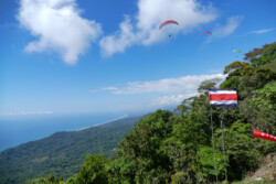 Getting higher! Discover Paragliding , high in the sky over the Dominical launch.