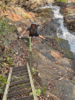 Andrew, hamming it up on the ladder back up from the waterfalls below. Quite the view