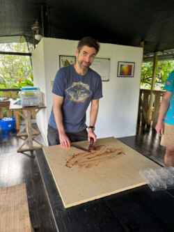 The amount of self control it took for him to simply not just lick the spatula was impressive! One of our students getting ready to spread the freshly made chocolate on the marble tempering plate.